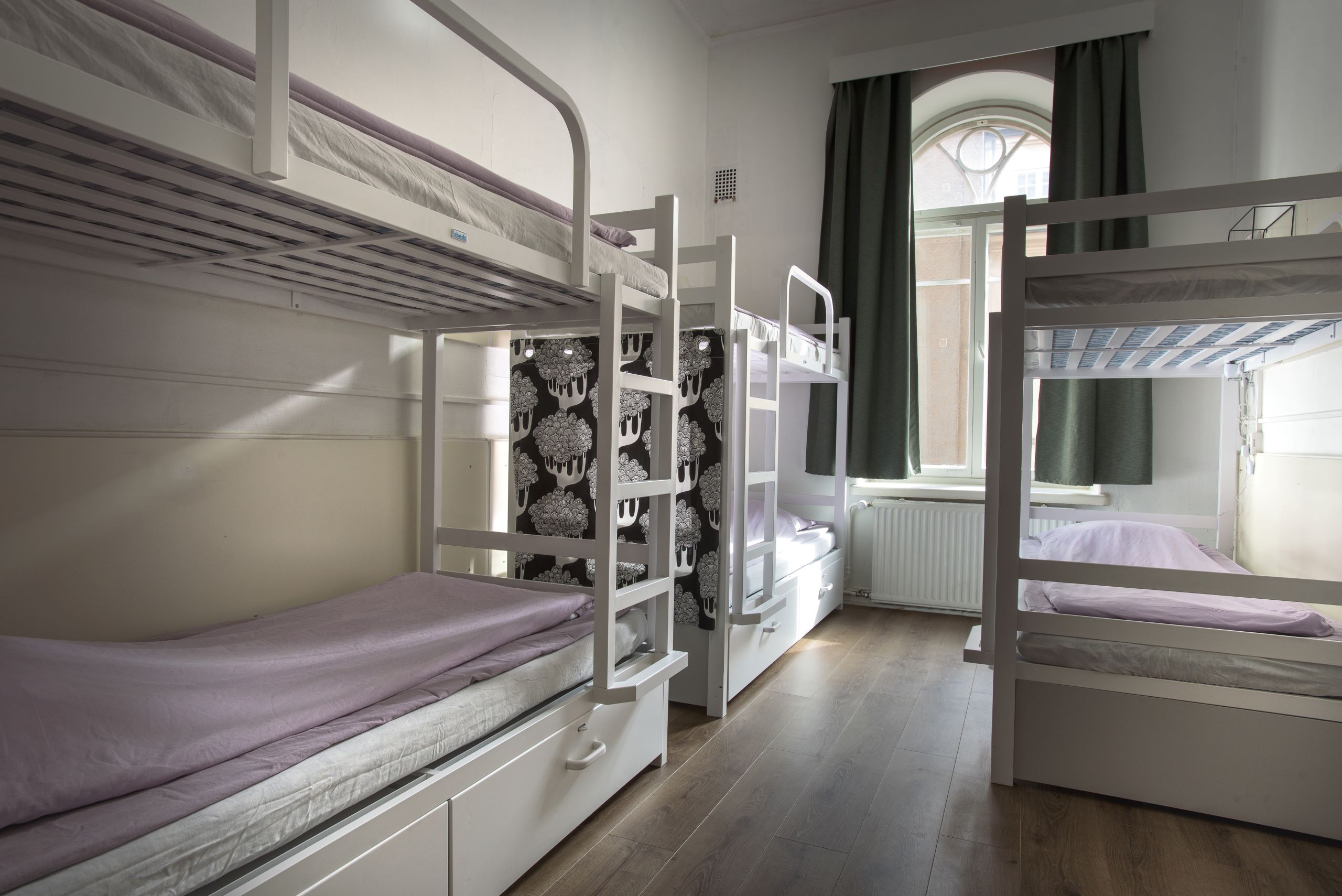 6-bed mixed dormitory room with personal security lockers at Hostel Diana Park Helsinki